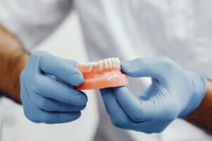 Full Mouth Reconstruction: Dental Implants VS Dentures
